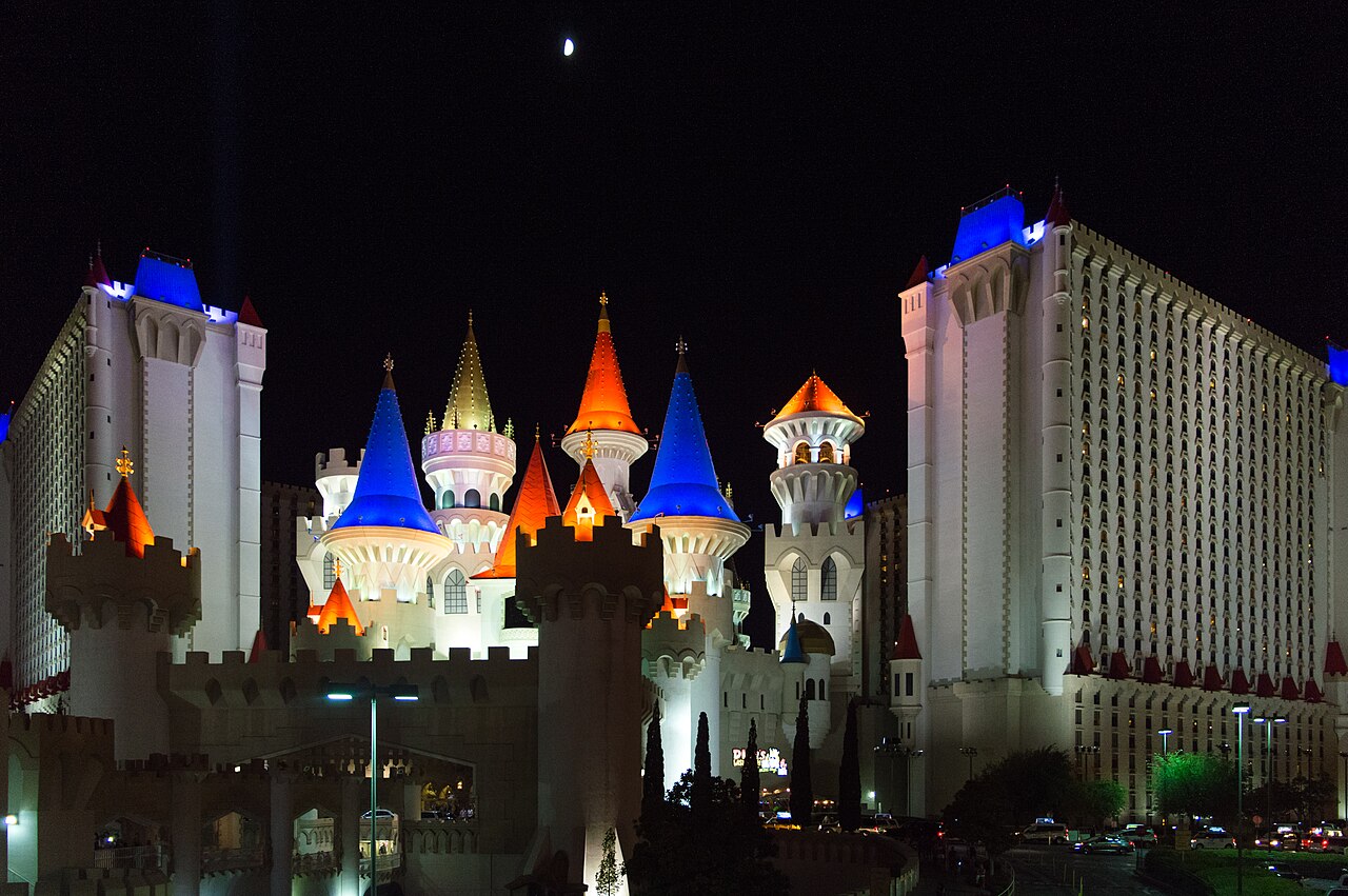 Casino hotel at night with city lights
