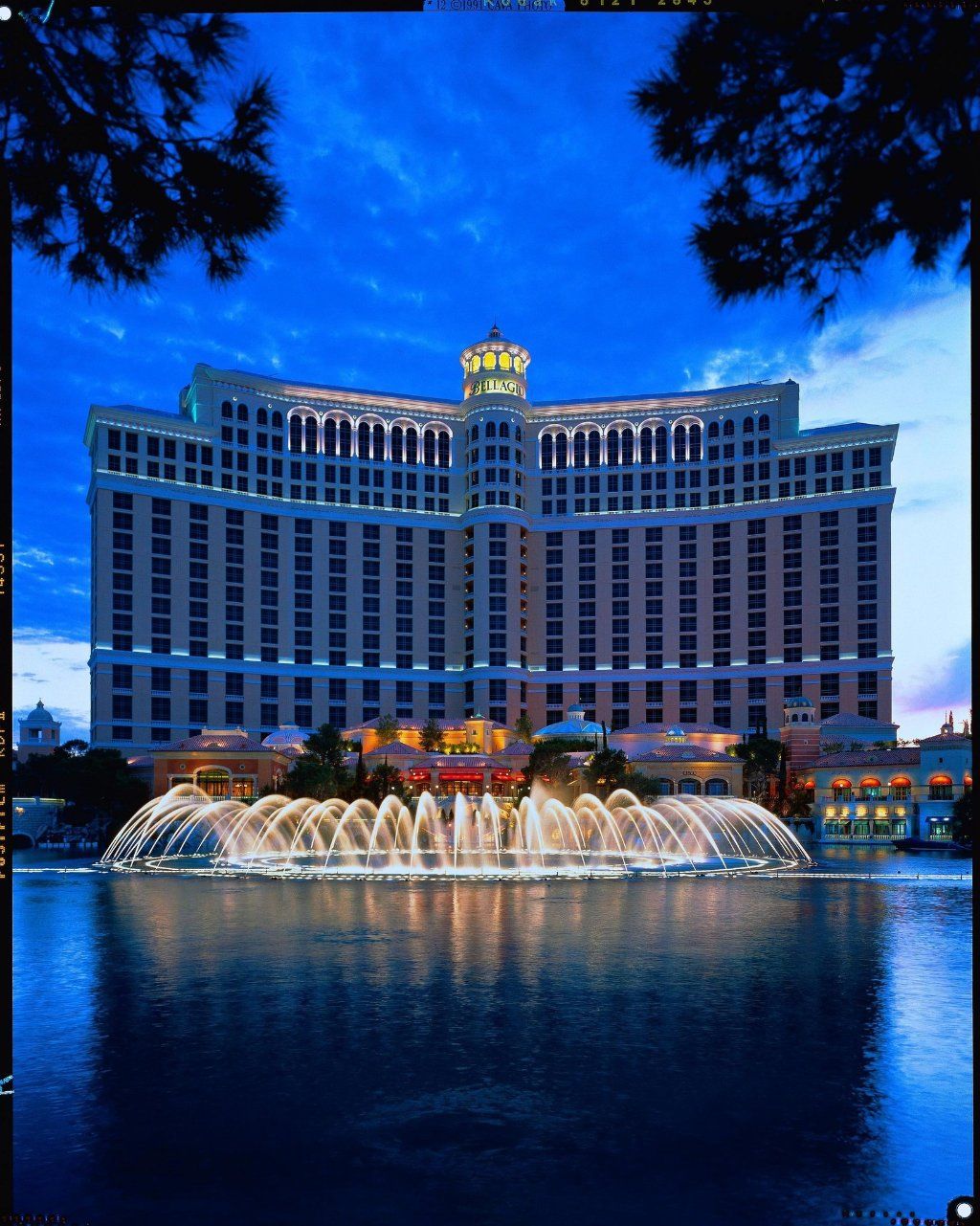 Modern casino hotel tower with city skyline view