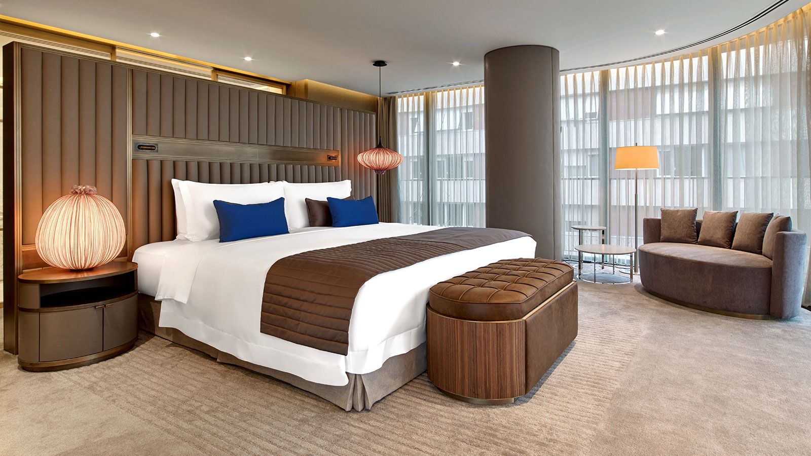 Premium casino hotel guest room with city views and soft lighting