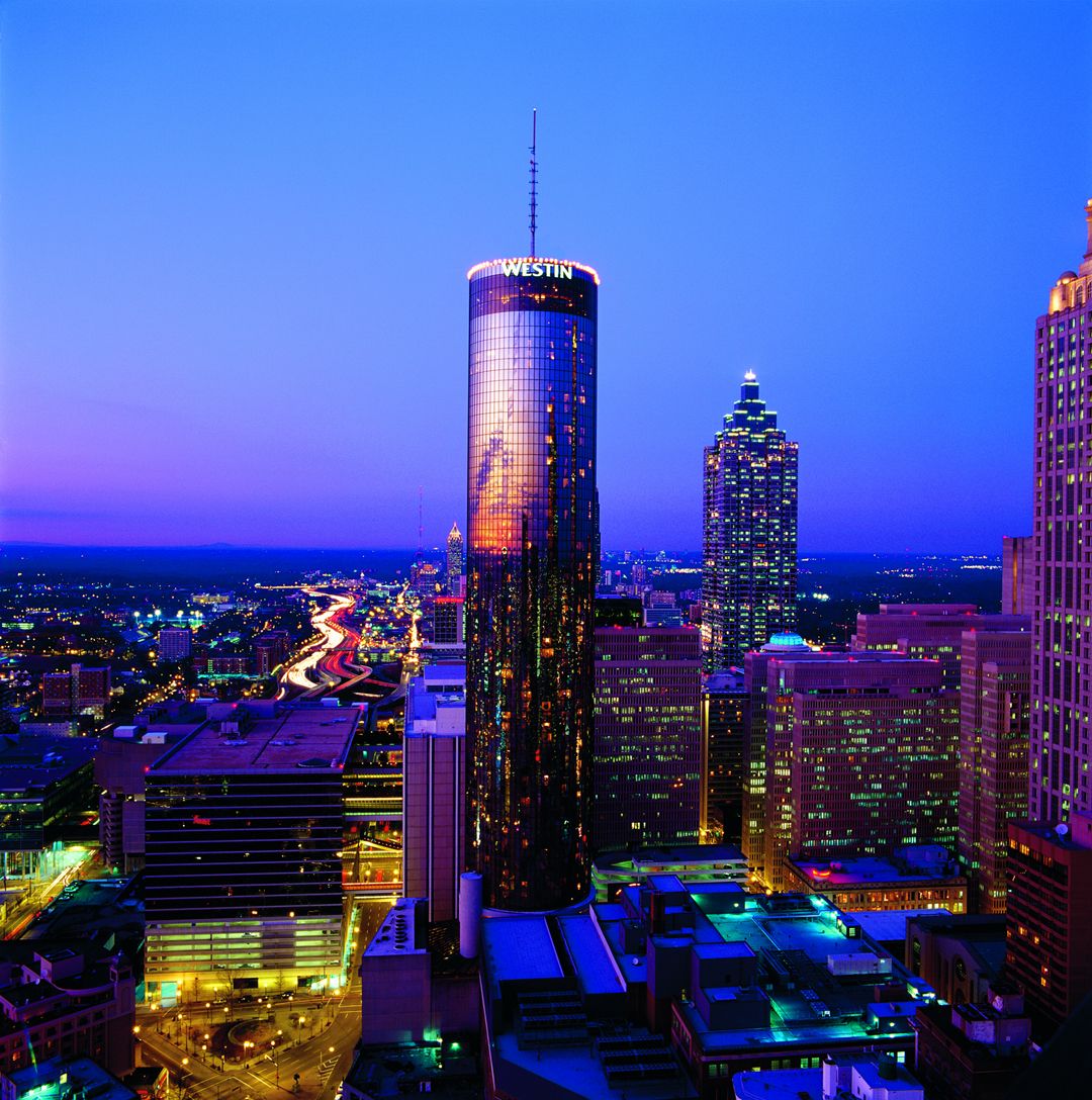 High-rise casino hotel at night with city views
